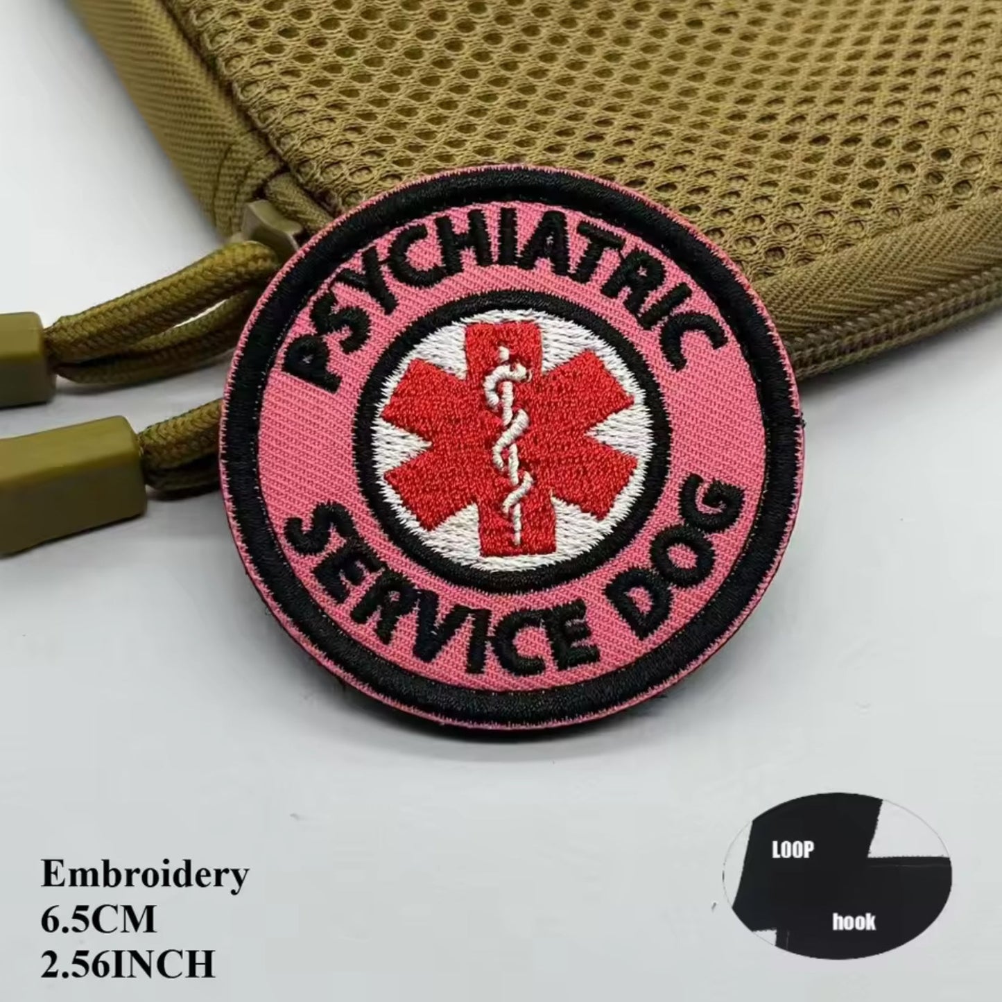 Pink 'Psychiatric Service Dog' patch on a beige background